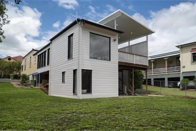 A double storey Queenslander extension with building design by Three Stems in Brisbane