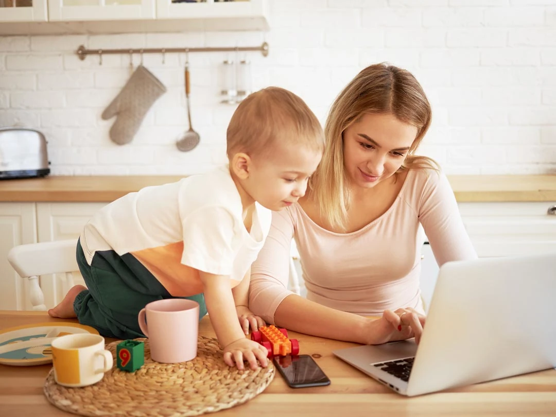 Family looking at house designs on laptop